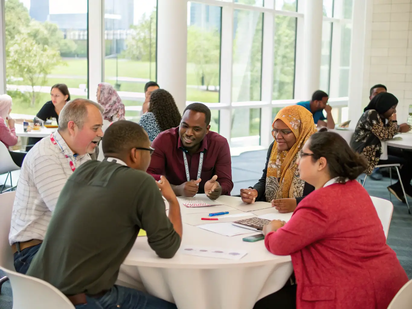 An image of diverse participants engaged in a lively discussion during a cultural forum, emphasizing the exchange of ideas and mutual understanding.